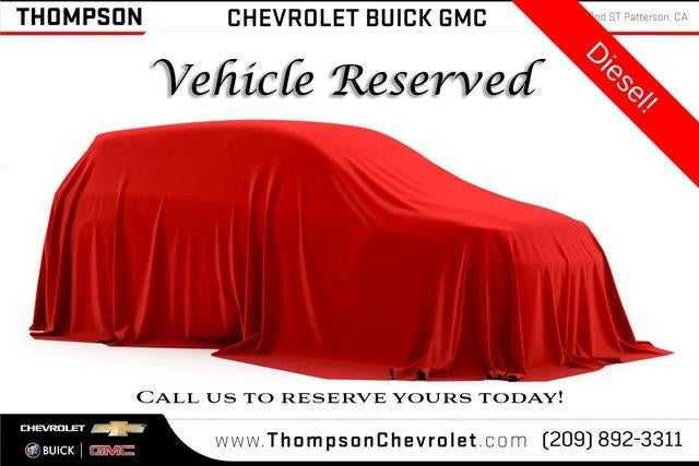 2026 GMC Yukon Denali in Glacier White Tricoat — front three-quarter view