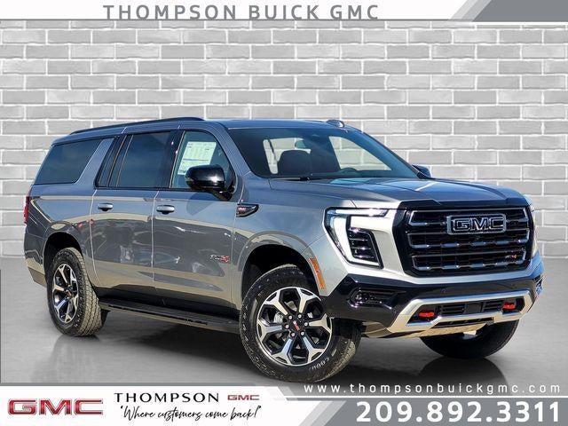 2026 GMC Yukon XL AT4 in Sterling Metallic — front three-quarter view