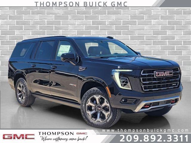 2026 GMC Yukon XL AT4 Ultimate in Onyx Black — front three-quarter view