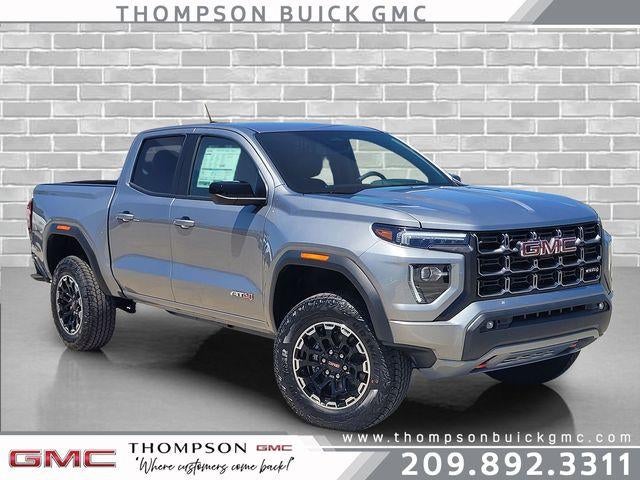 2026 GMC Canyon AT4 in Sterling Metallic — front three-quarter view