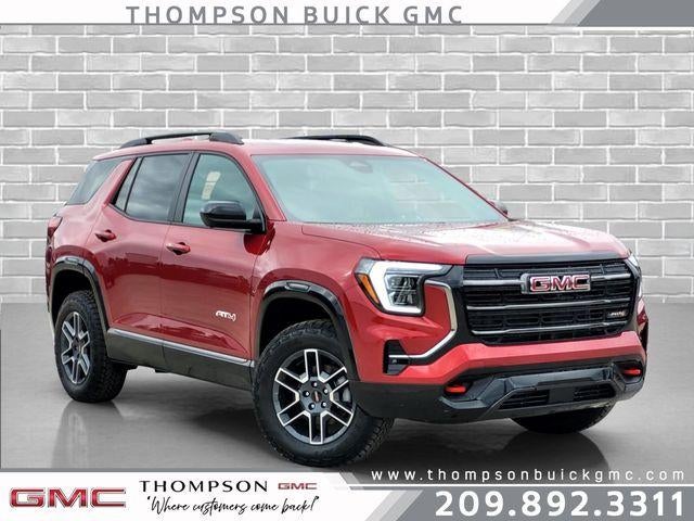2026 GMC Terrain AT4 in Volcanic Red Tintcoat — front three-quarter view