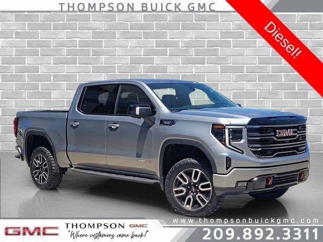 2026 GMC Sierra 1500 AT4 in Sterling Metallic — front three-quarter view